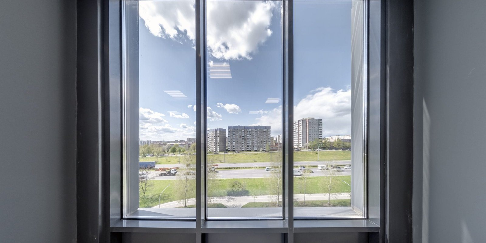 empty modern hall room with columns, doors and panoramic windows.
