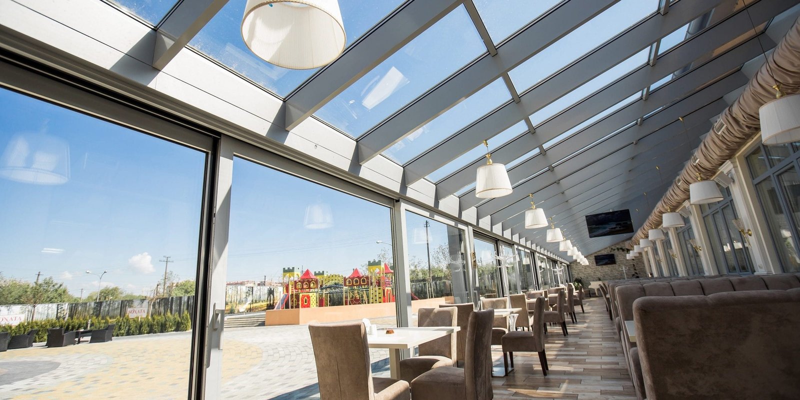 A bare office building interior. A modern panoramic window and view of Alabang skyline. Interior concept. Architectural background.